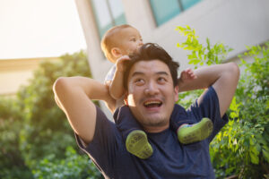 Happy father and son outside | Male Infertility | Reproductive Science Center of the Bay Area