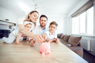 young family puts money in piggy bank saved through CapexMD's financing assistance | Reproductive Science Center of the San Francisco Bay Area