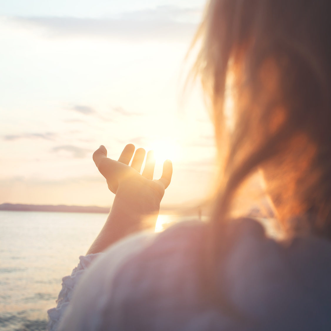 Vitamin D & uterine fibroids| RSC Bay Area | photo of woman reaching toward the sun